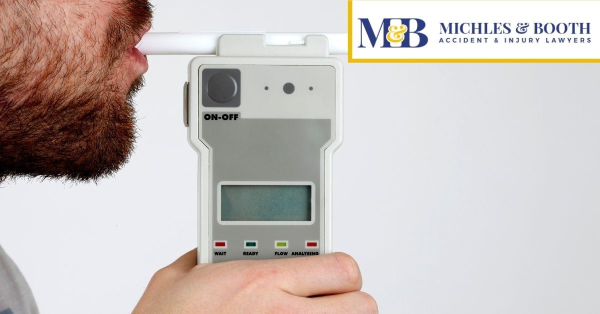 Man blowing into a breathalyzer